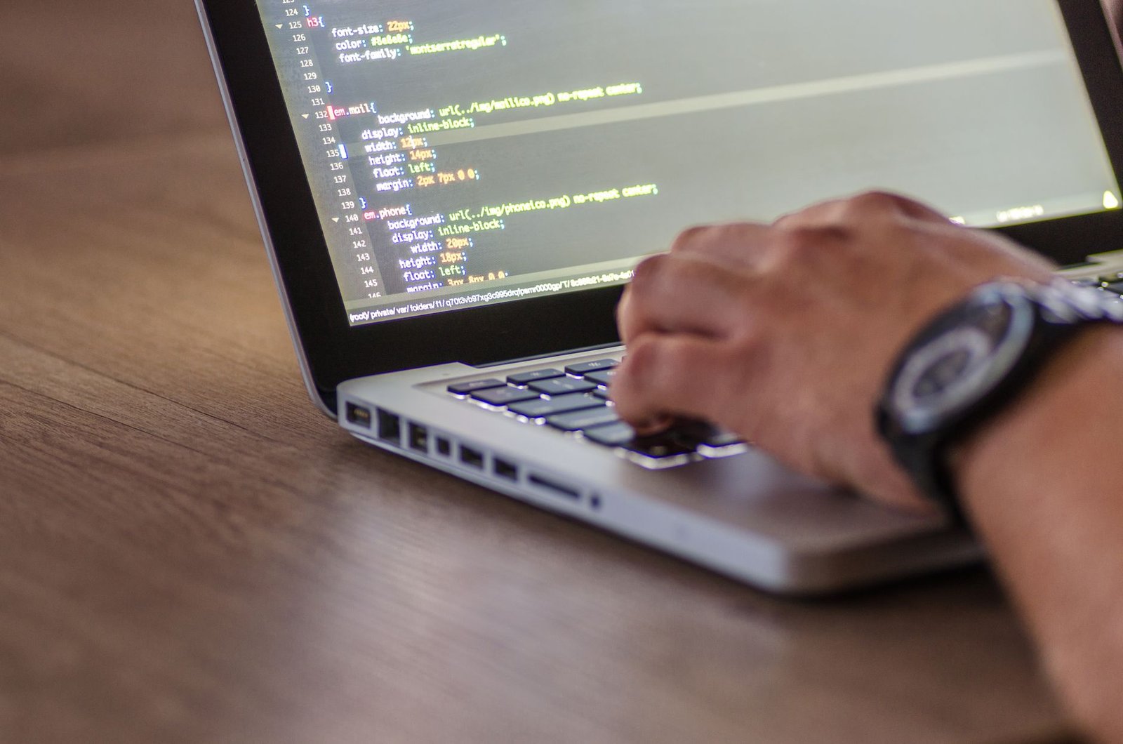 Developer reviewing build pipeline metrics on screen