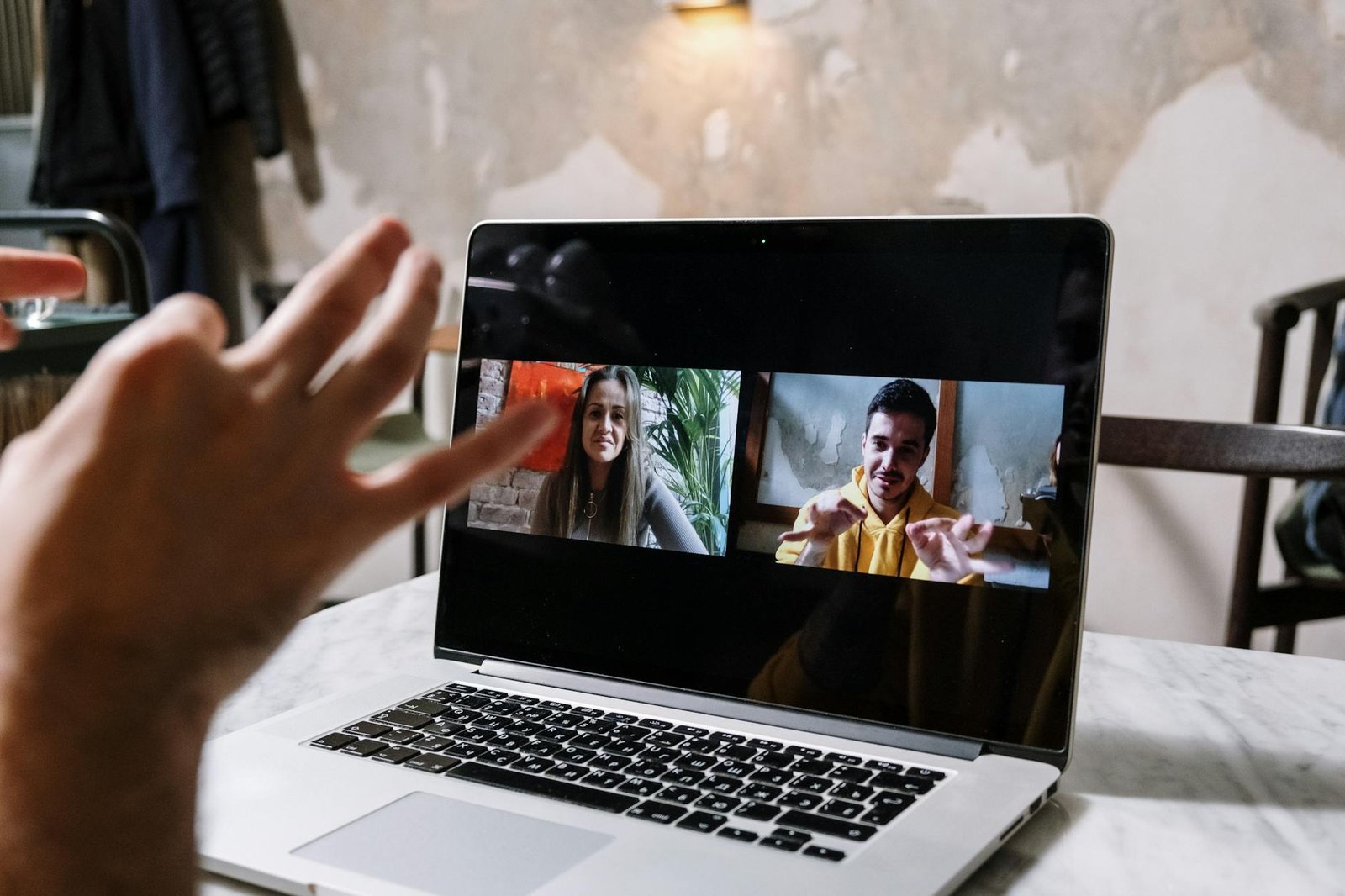 Team on a video conference call with an AI notetaker running