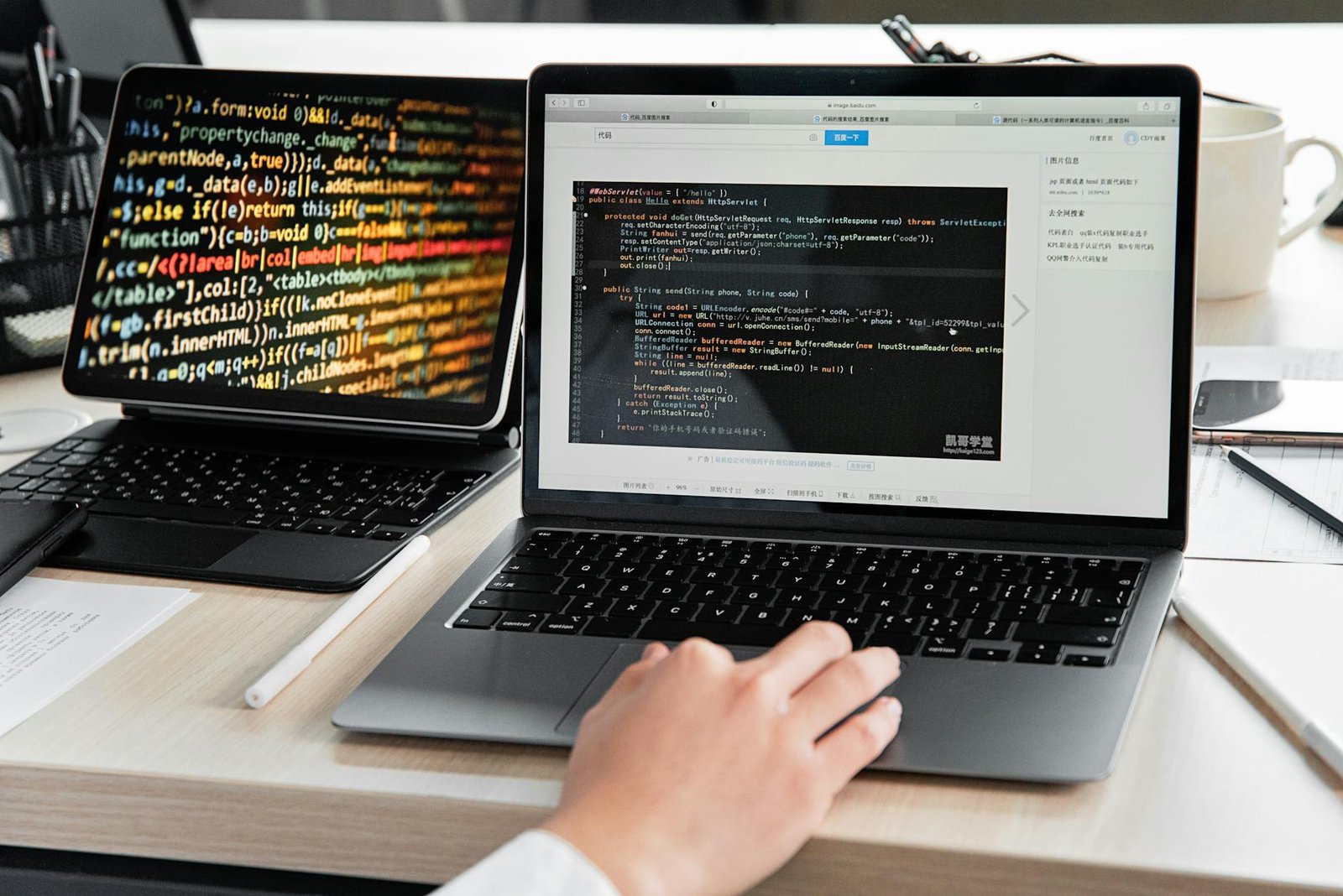 Developer building internal tools with code on a laptop screen