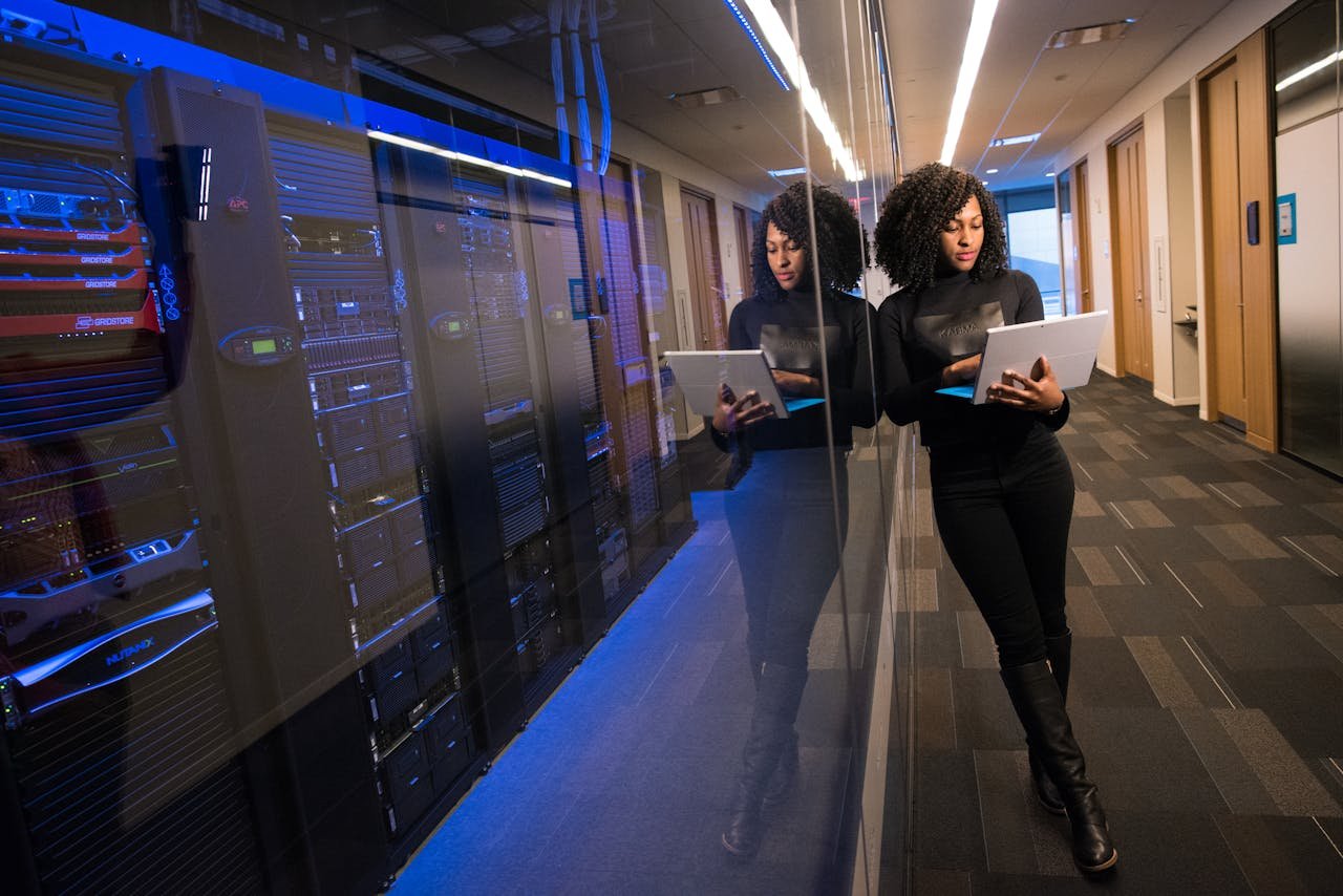 Engineer reviewing server monitoring dashboard in data center